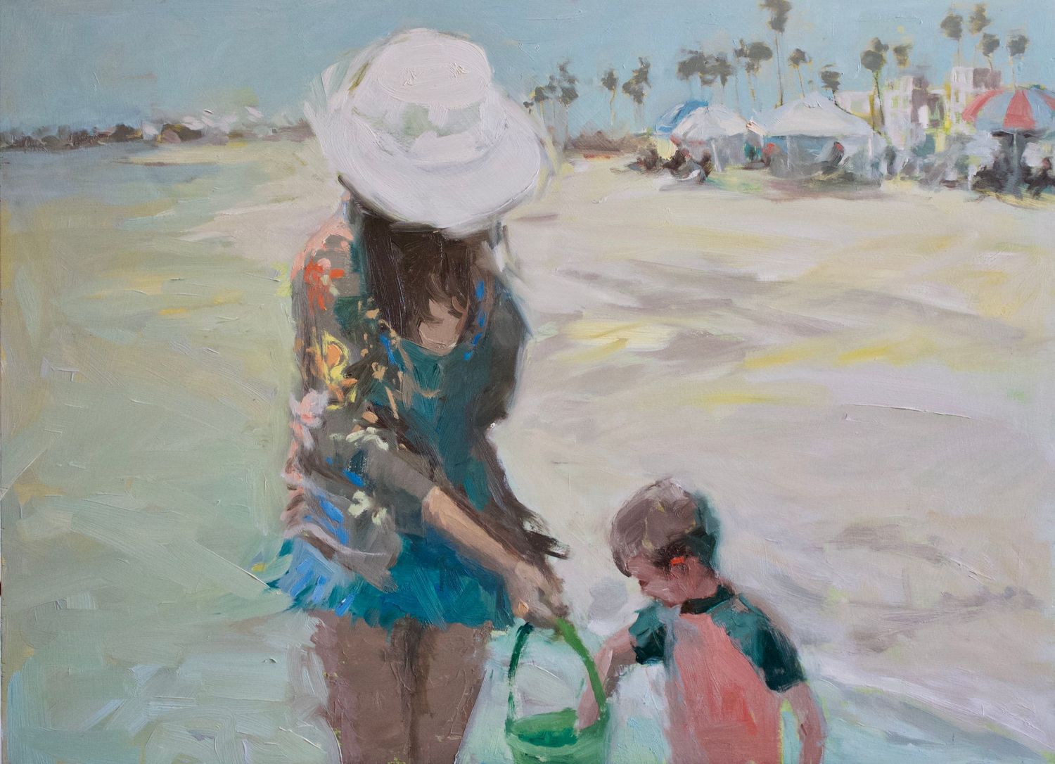 WOMAN IN WHITE SUNHAT AND BATHING SUIT AND A LITTLE BOY ON THE BEACH IN SUMMER