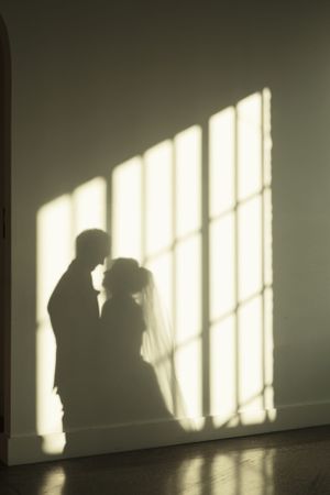 A detailed shot of a couple's shadow before their ceremony
