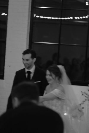 motion blur shot of a couple running down the aisle after being pronounced husband and wife