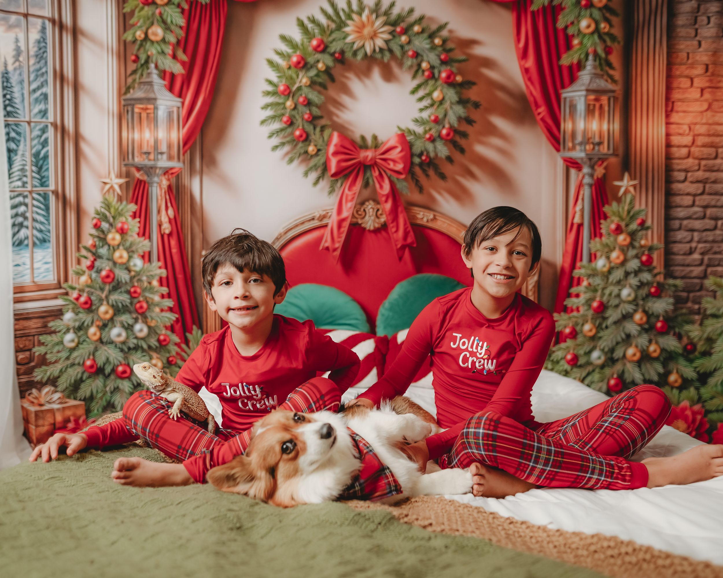 Holiday photo backdrop featuring red curtains, Christmas wreaths and seasonal decorations.