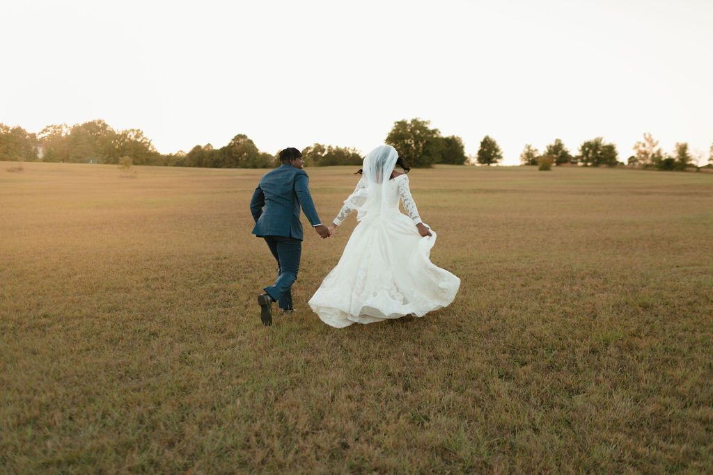 Wedding portraits in wildflower field at Sanctuaire Atelier.