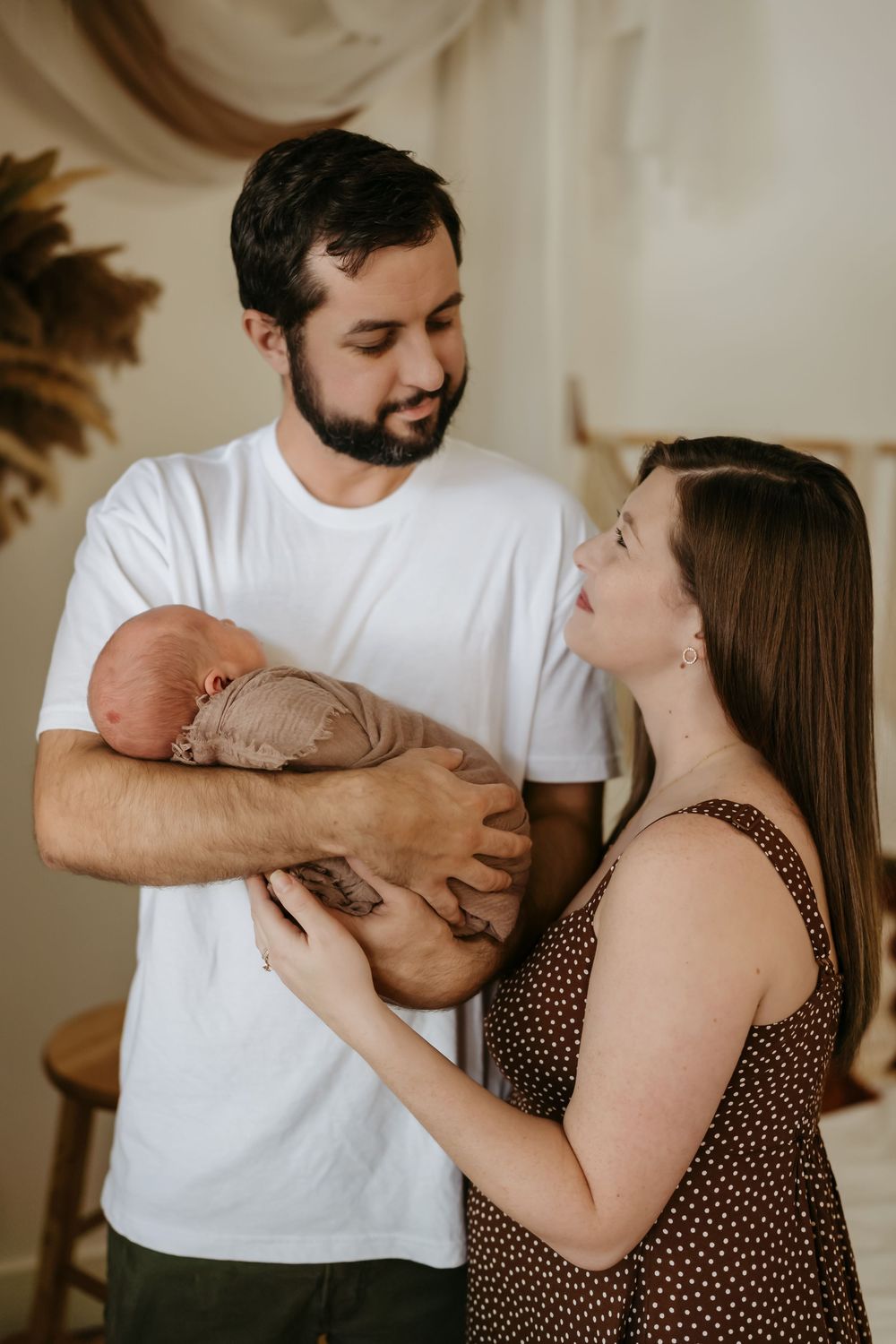 A couple in white and polka dot outfits share tender moments in series of intimate candid photographs.