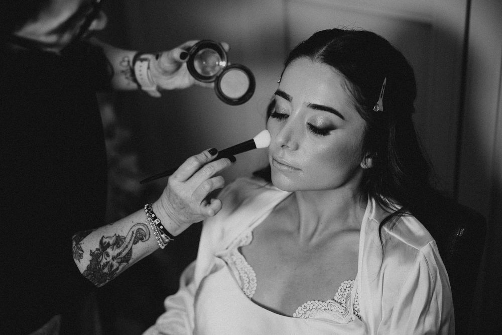 Black and white wedding photo collage showing intimate romantic moments between a bride and groom.