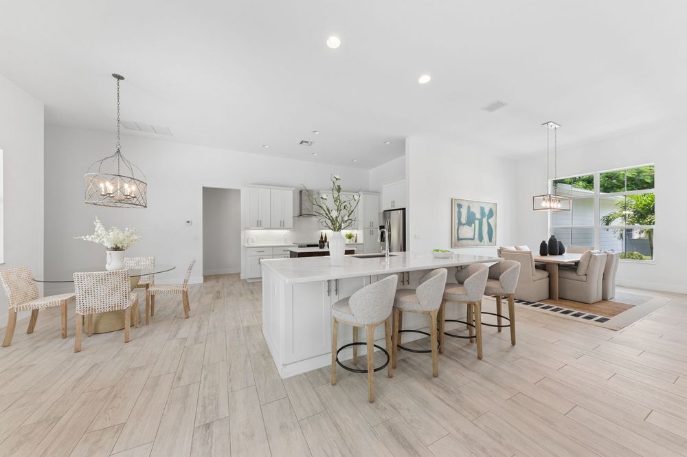 Real estate photography for this luxurious open-concept living and dining area in Palm Beach Gardens Real estate photographer in Palm Beach