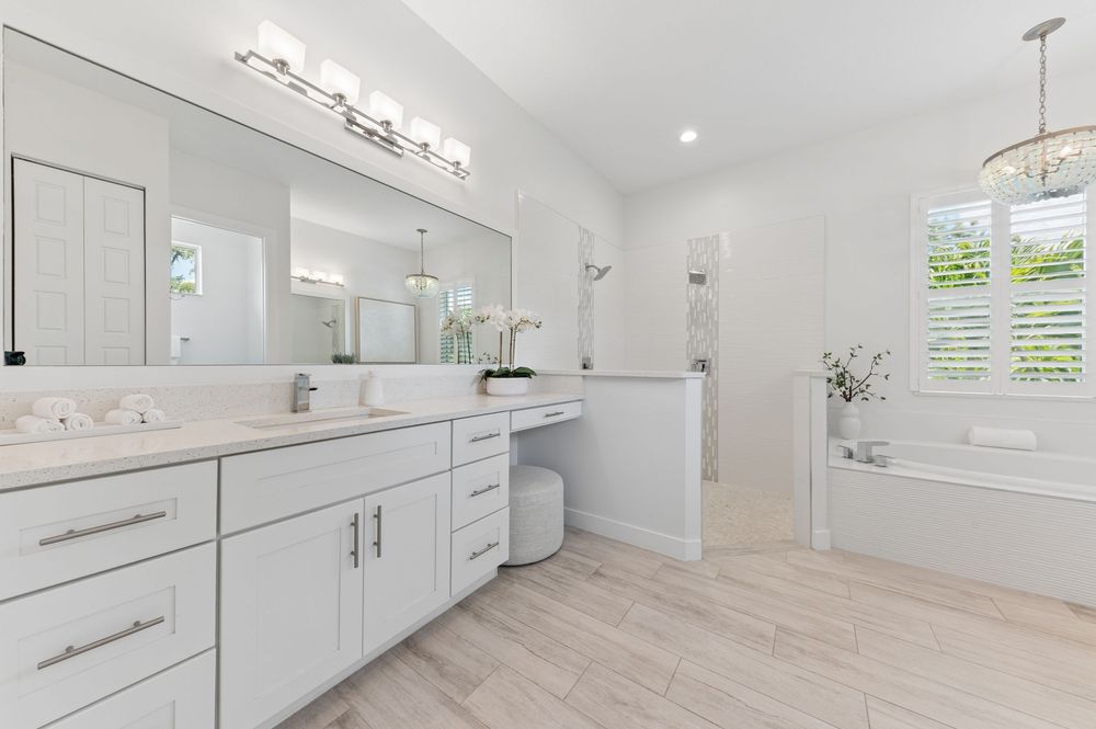 Real estate photography for this luxurious open-concept living and dining area in Palm Beach Gardens Real estate photographer in Palm Beach