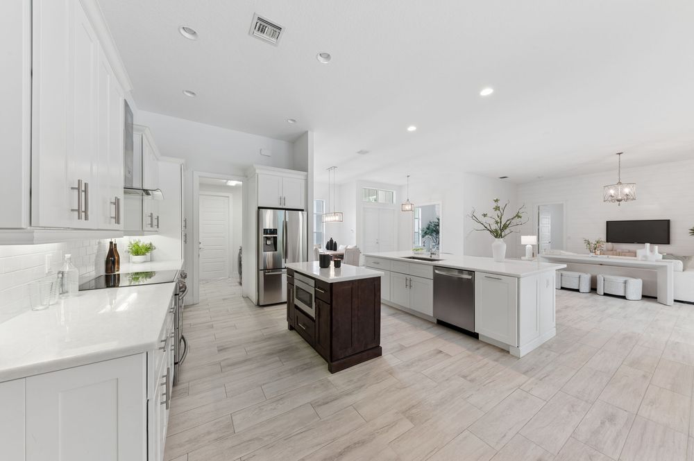 Real estate photography for this luxurious open-concept living and dining area in Palm Beach Gardens Real estate photographer in Palm Beach
