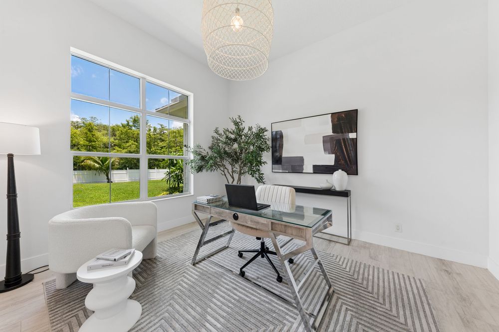 Real estate photography for this luxurious open-concept living and dining area in Palm Beach Gardens Real estate photographer in Palm Beach