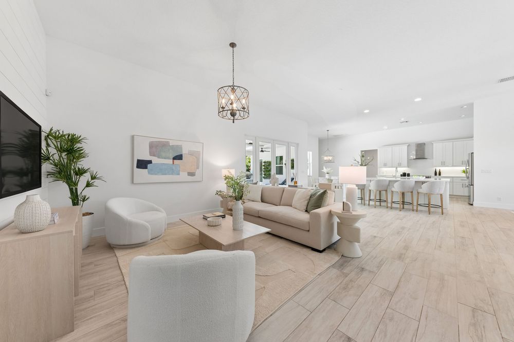 Real estate photography for this luxurious open-concept living and dining area in Palm Beach Gardens Real estate photographer in Palm Beach