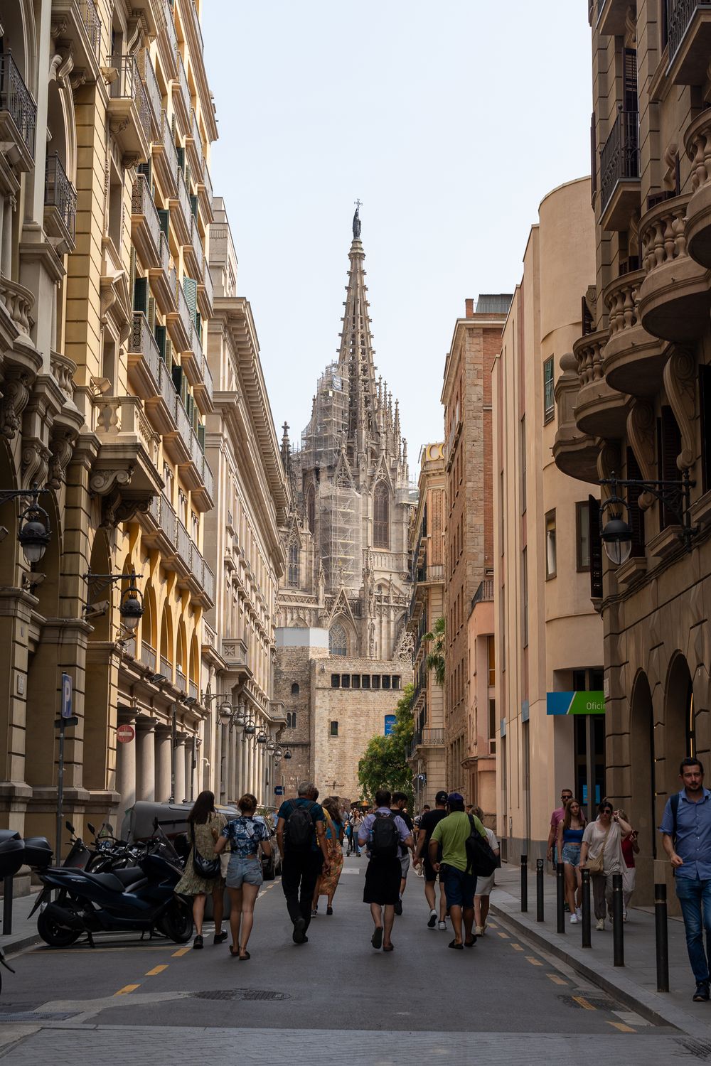 Gothic cathedral spires rise above narrow streets in Barcelona's historic Gothic Quarter.