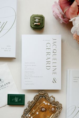 Elegant wedding invitation suite for Jacqueline and Gerard with a green velvet ring box and gold tray.