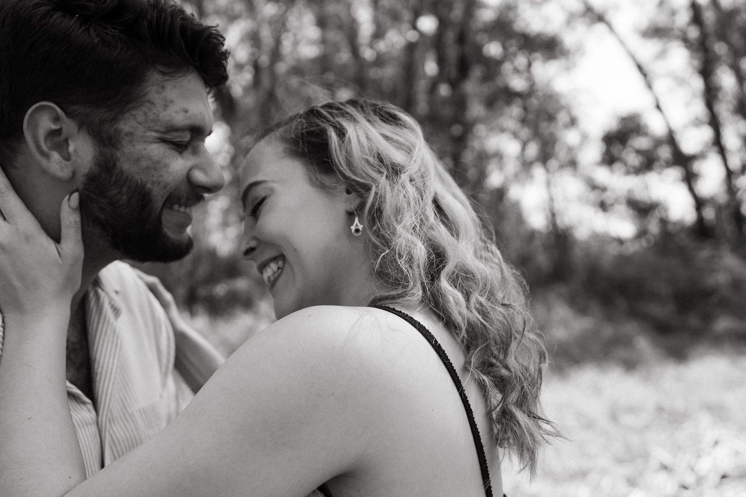 Black and white photo sequence of couple sharing intimate moments in woodland.