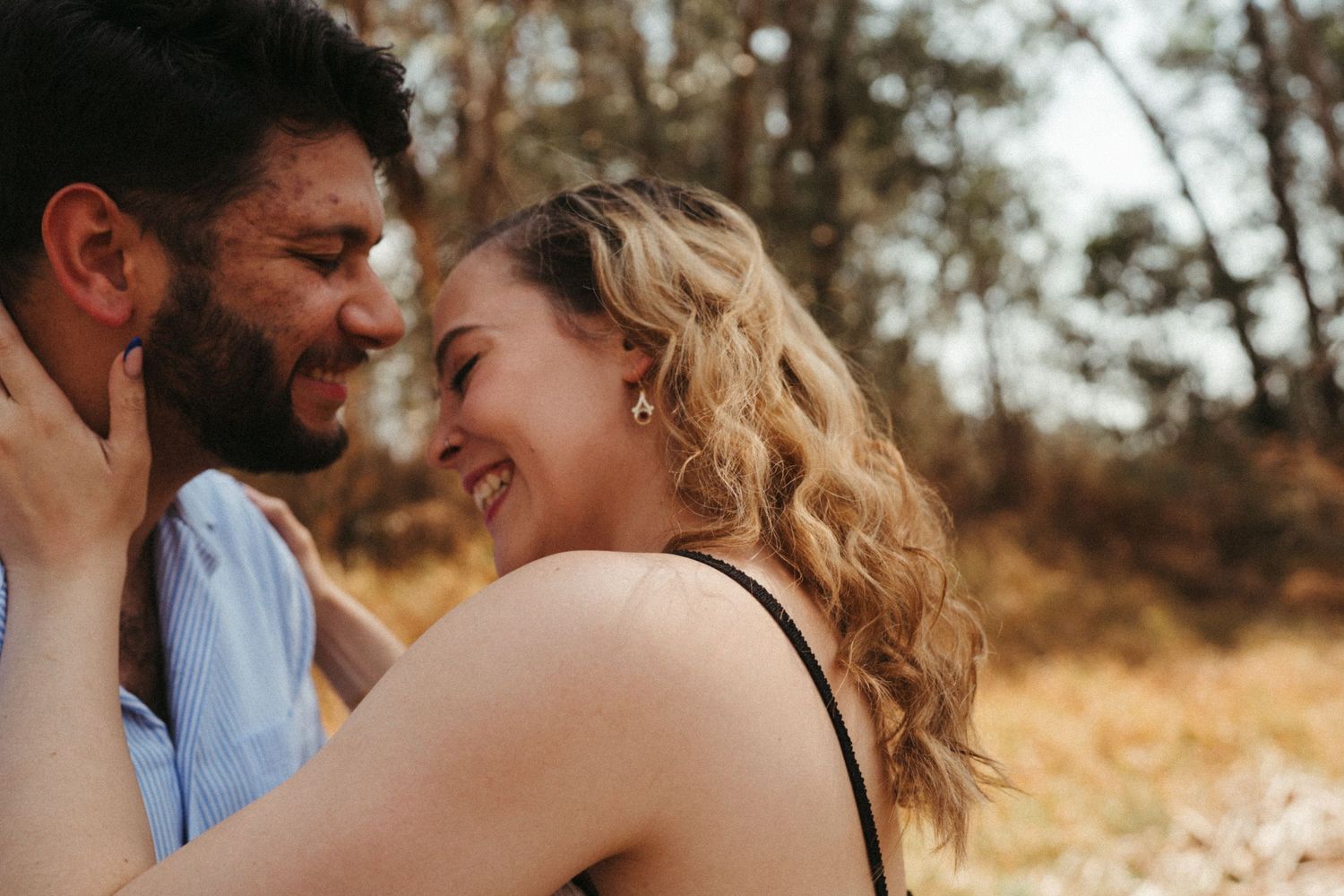 Romantic photo strip capturing tender moments between couple in natural setting.