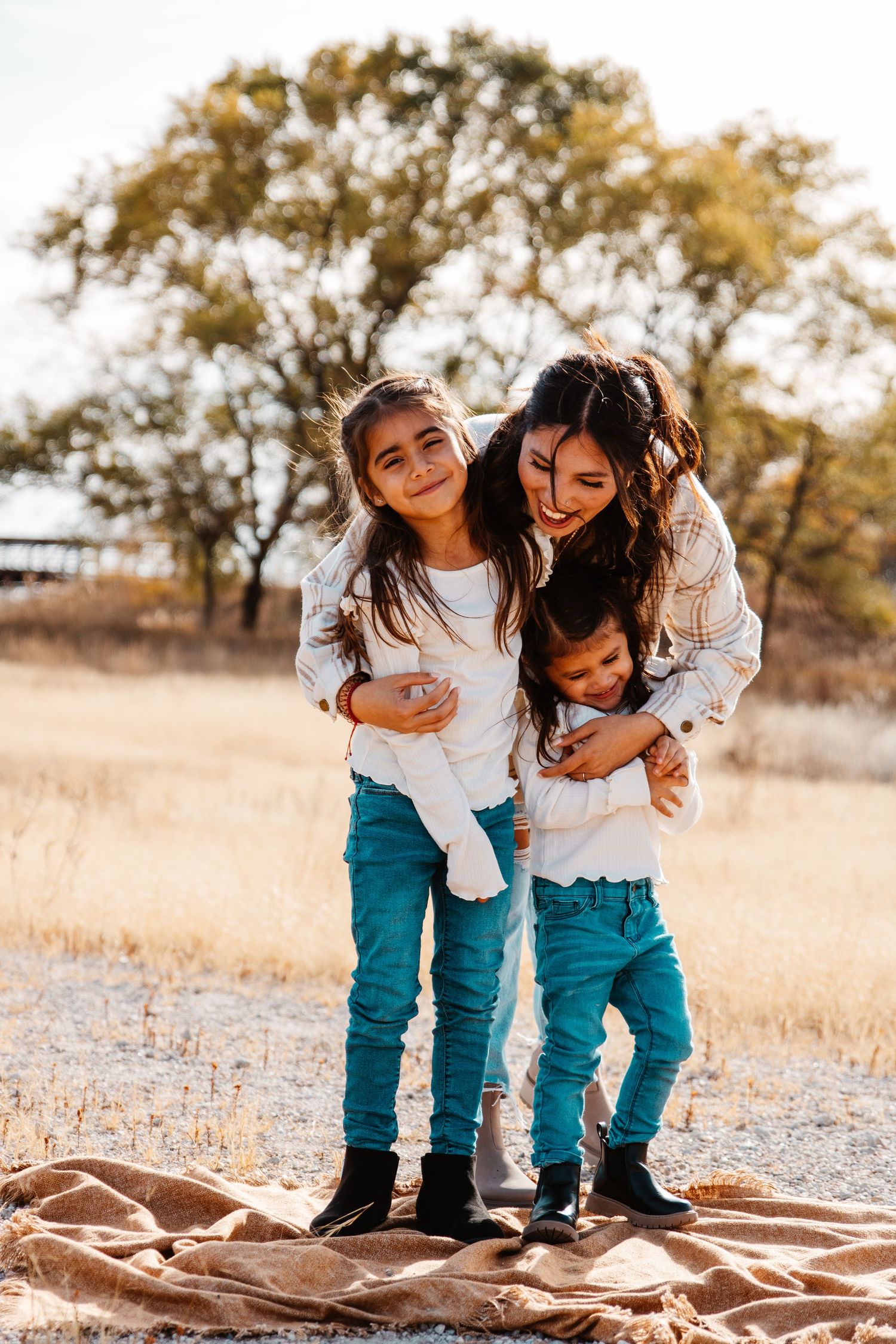 Candid moment between family members during family portrait in Kearney, NE