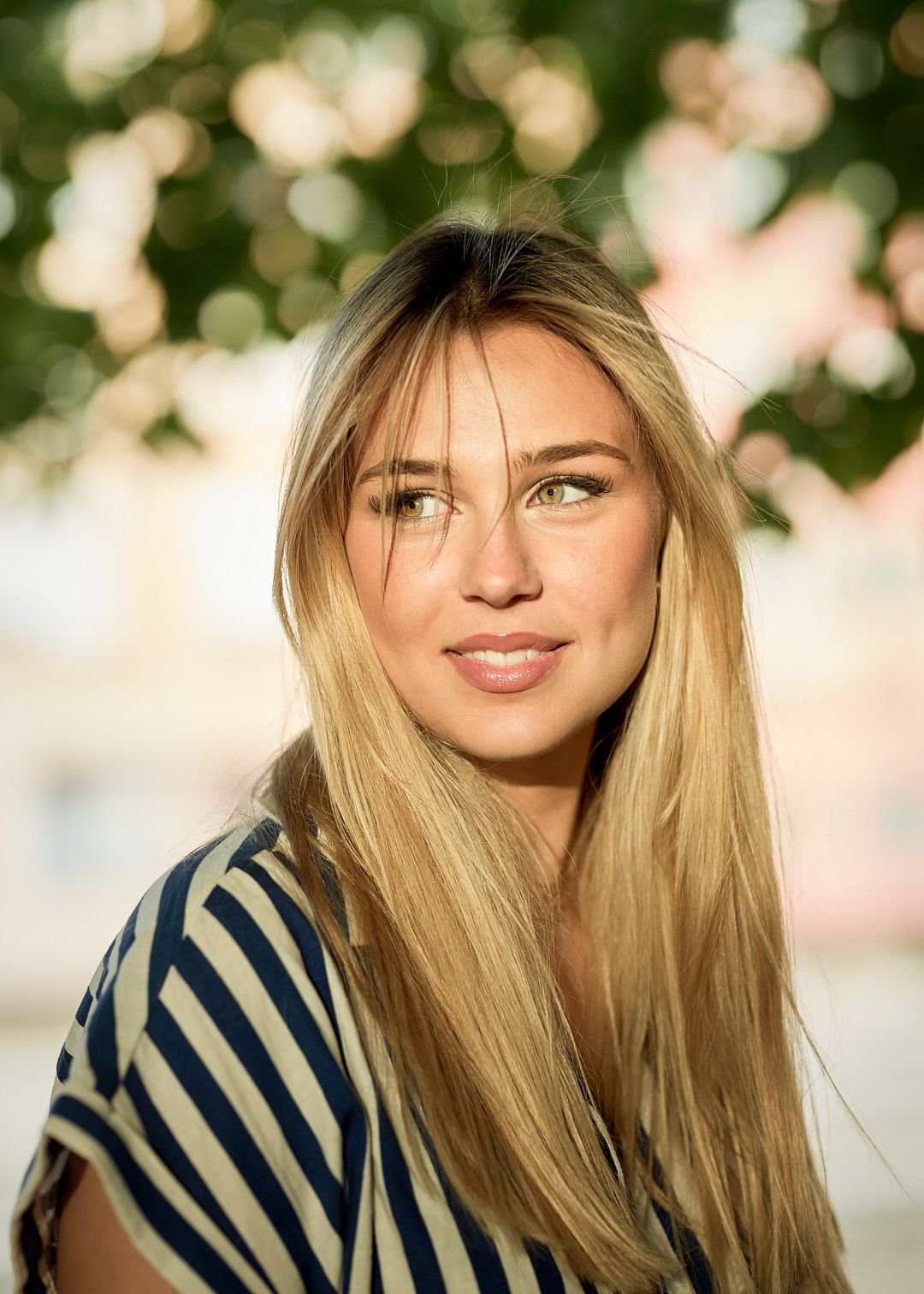 young blonde girl smiles in girona