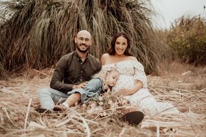 Natural light family photography session showing authentic connections and laughter.