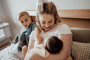 Tender family moment captured on cozy indoor furniture.