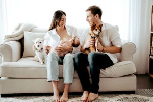Candid lifestyle photoshoot showing relaxed moments on white couch at home.