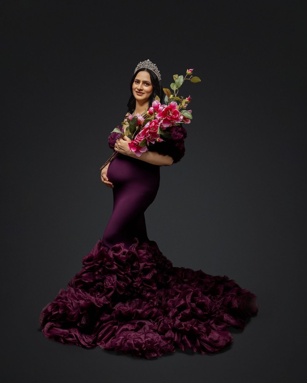 A series of elegant dance poses in a flowing purple flamenco dress against a dark background.