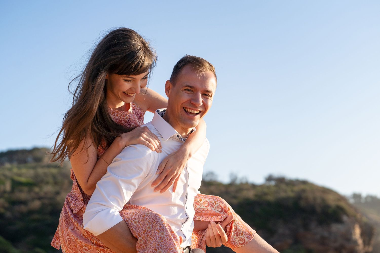 Couples games during a Valentine's day photoshoot, girl gets a piggyback ride from partner in Sydney