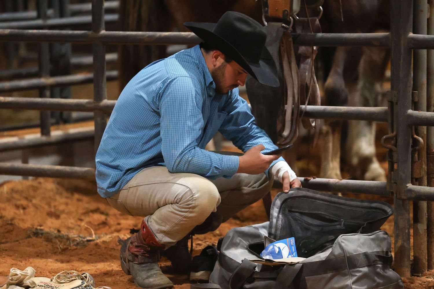 Behind the chutes getting ready for his retirement ride. Bronc Rider