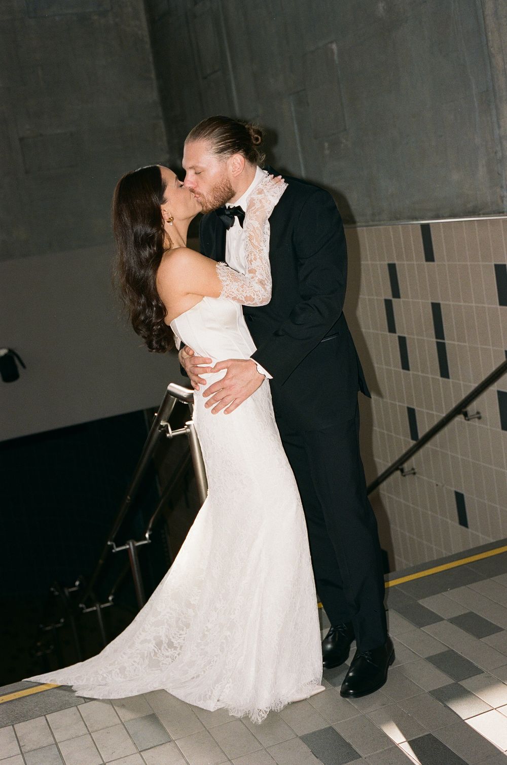 A romantic sequence of wedding photos shows a couple sharing their first dance in a dimly lit venue.