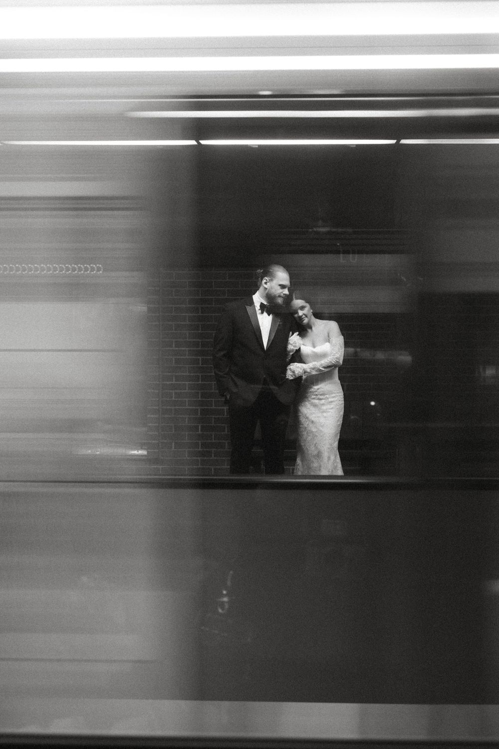 A series of black and white motion blur photographs showing a couple dancing in silhouette through window frames.