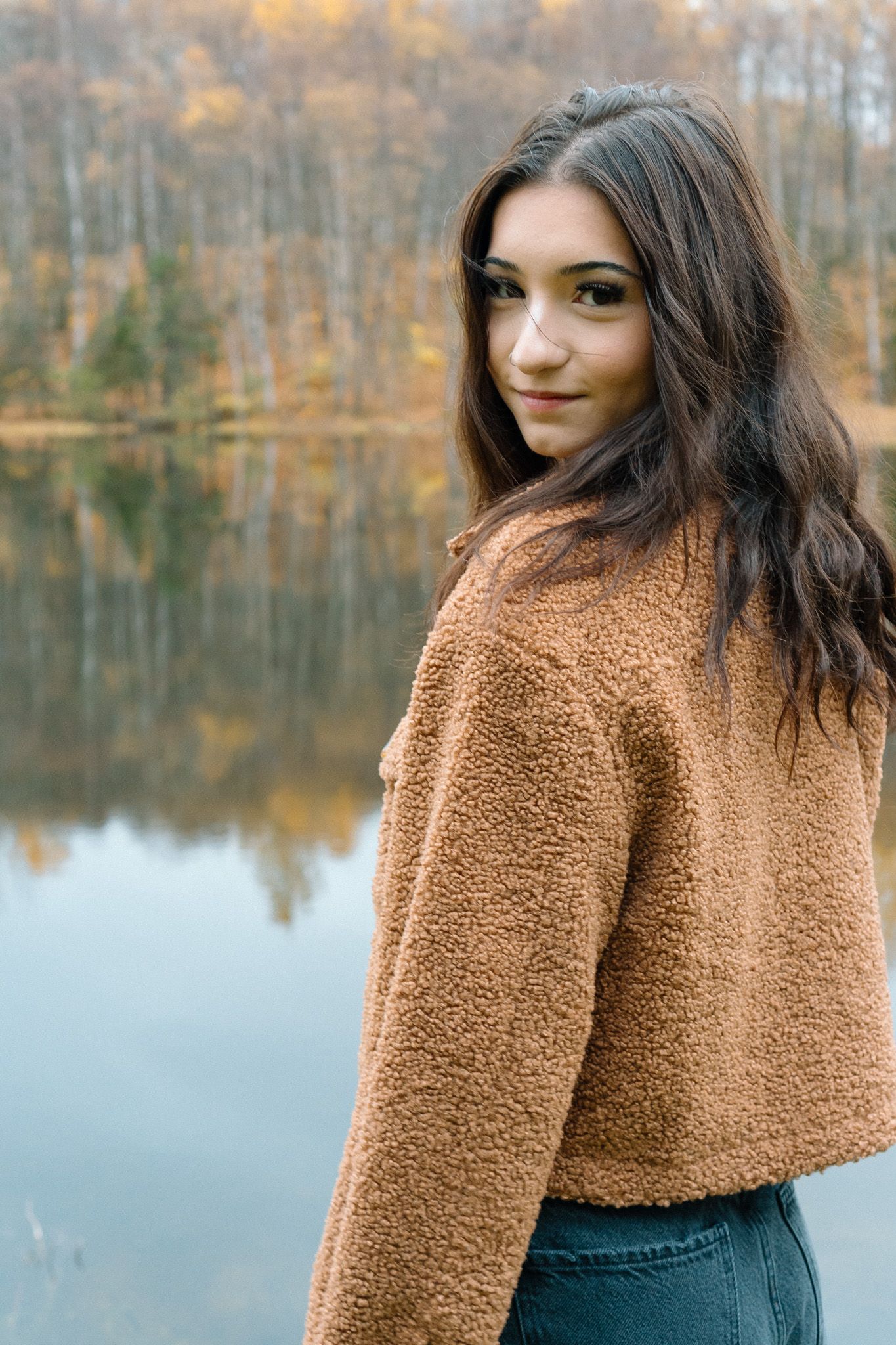 Senior photos coming up with the fall colors of Alaska in the background