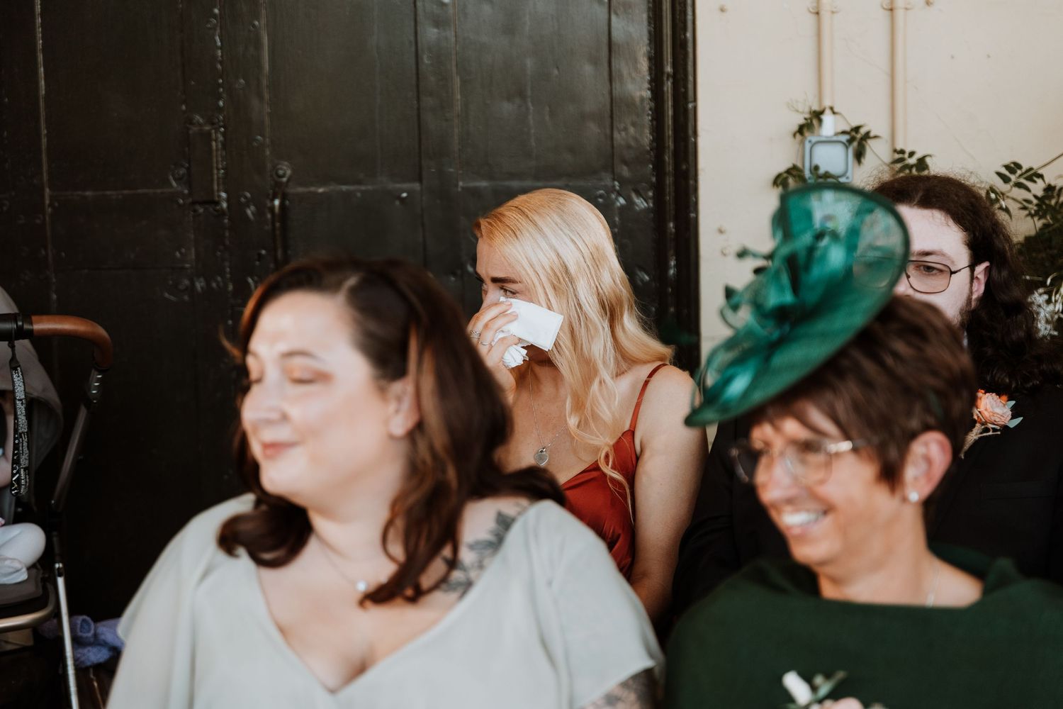 A series of candid wedding photos showing guests laughing and enjoying themselves during the celebration.