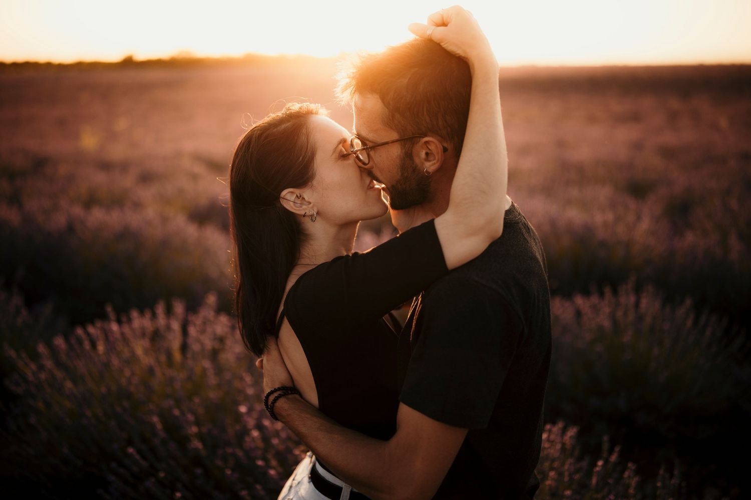 A romantic sunset moment captured in a lavender field.
