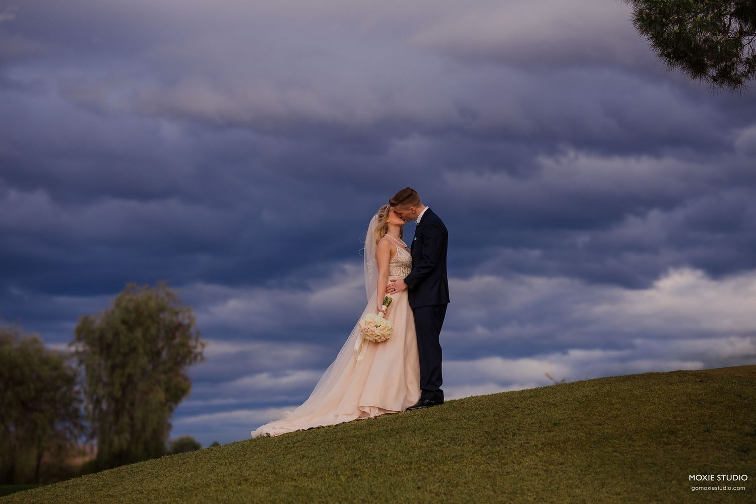 bride and groom portraits at DragonRidge Country Club sunset