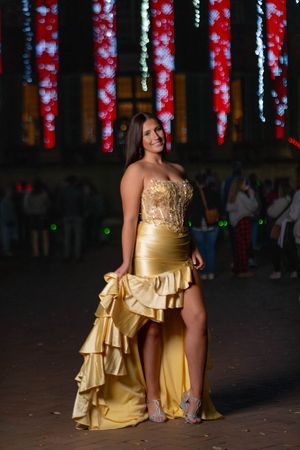 High school senior posing in formal prom dress for professional prom photography in Charleston SC