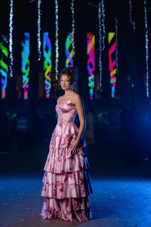 High school senior posing in pink floral prom dress for Charleston South Carolina portrait photography