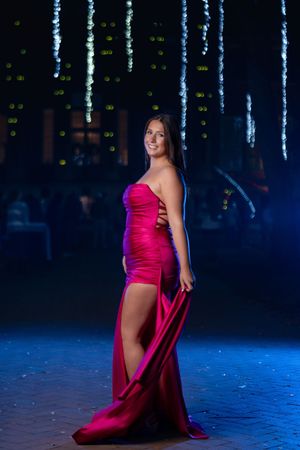 Charleston SC prom portrait of high school senior wearing elegant pink formal gown at night