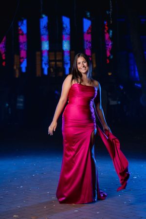 Charleston prom photographer capturing high school senior portrait in bright pink evening gown