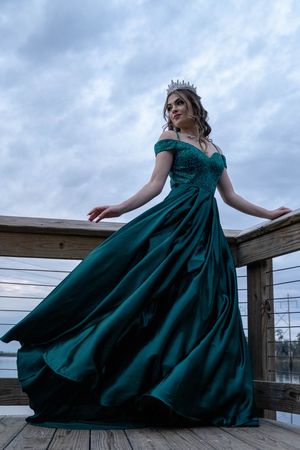 High school senior posing in elegant green prom dress for Charleston South Carolina senior portrait photography