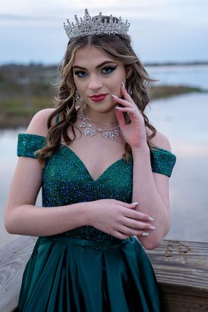High school senior posing in elegant green prom dress for Charleston South Carolina senior portrait photography