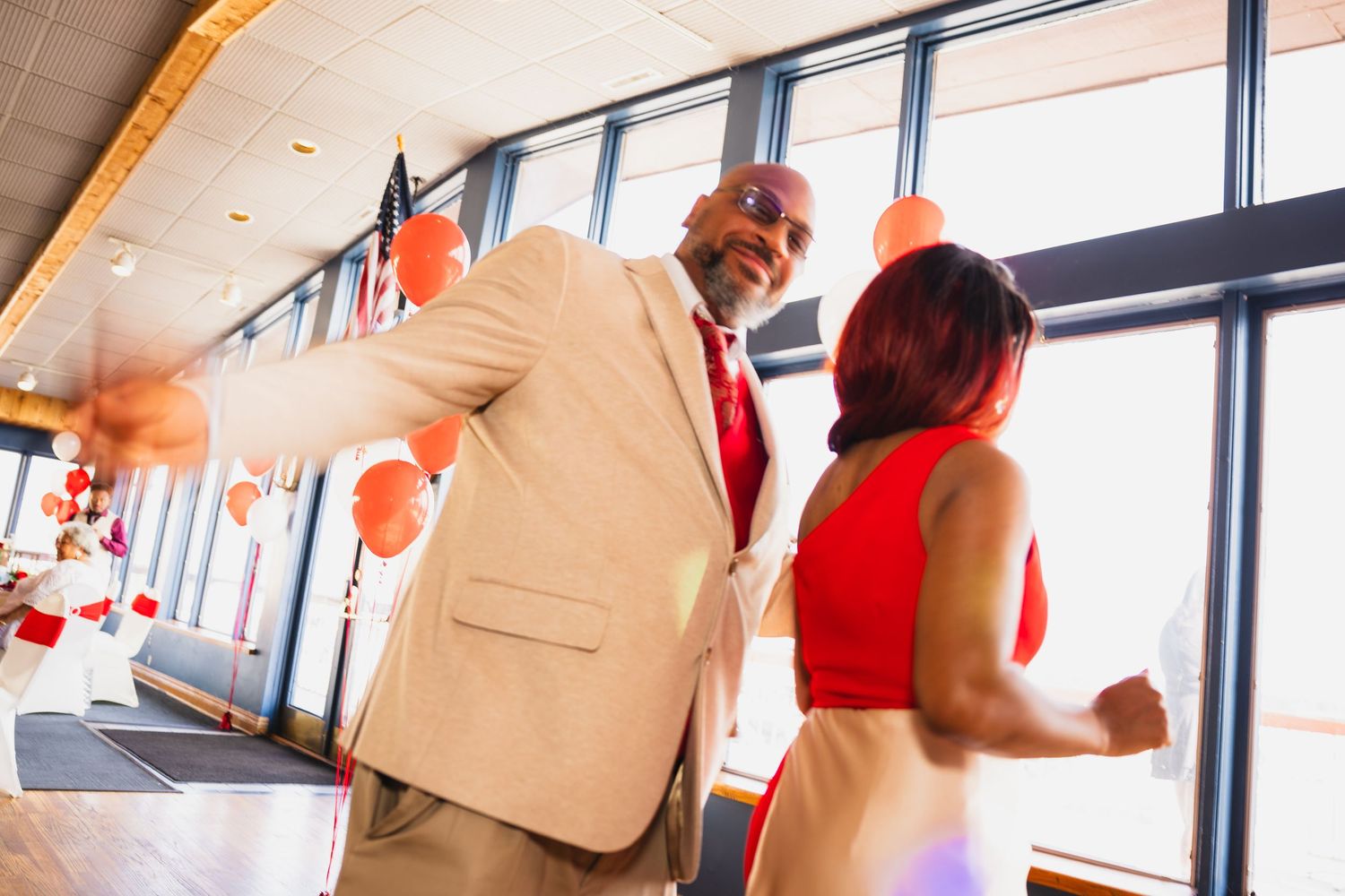 A candid photo of a couple dancing at a formal event at Sinbad's Detroit