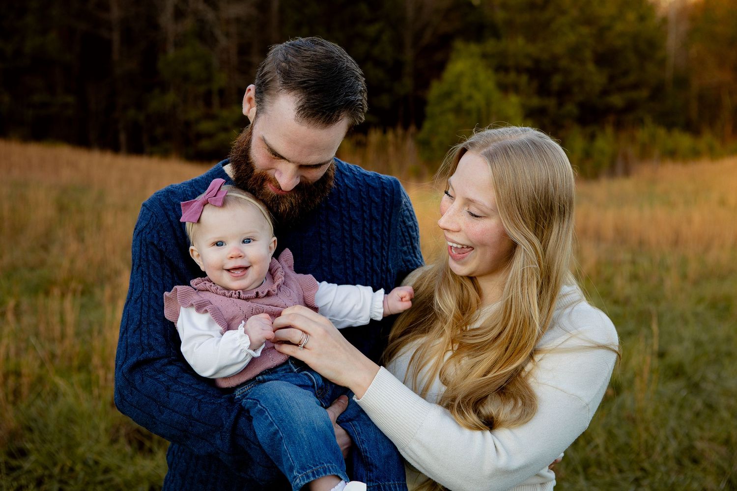 Candid family laughing together during outdoor session Western NC