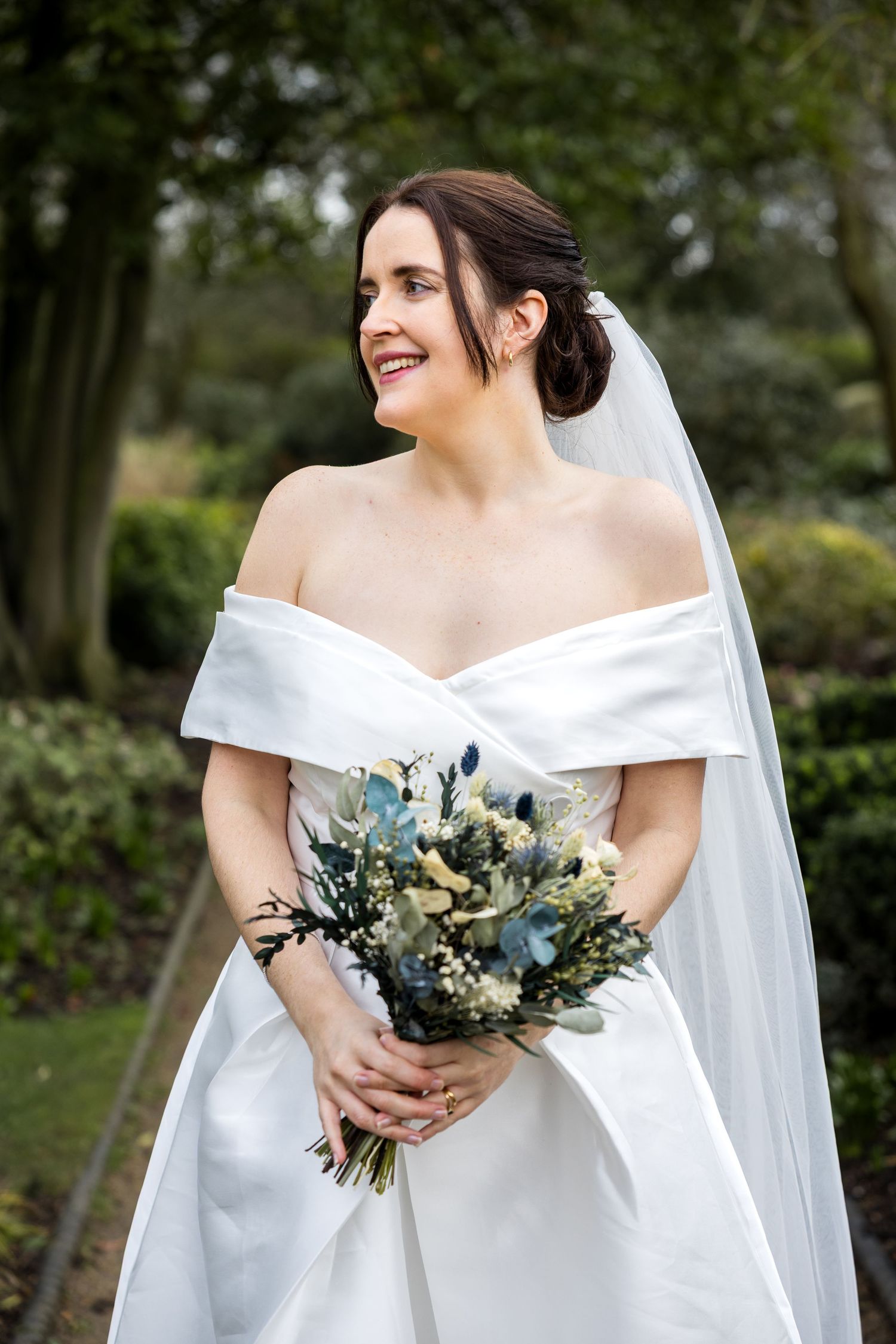 portrait of the bride smiling and looking over her shoulder