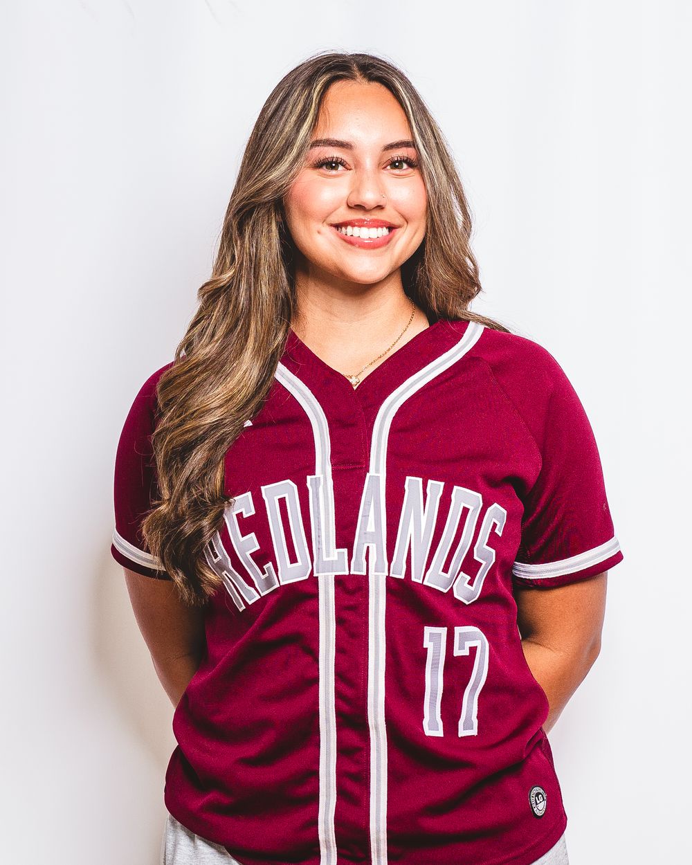 Maroon baseball jersey uniform displayed in multiple poses against white background.