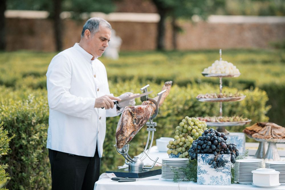 Traditional Portuguese ham carving station at luxury wedding cocktail in Portugal