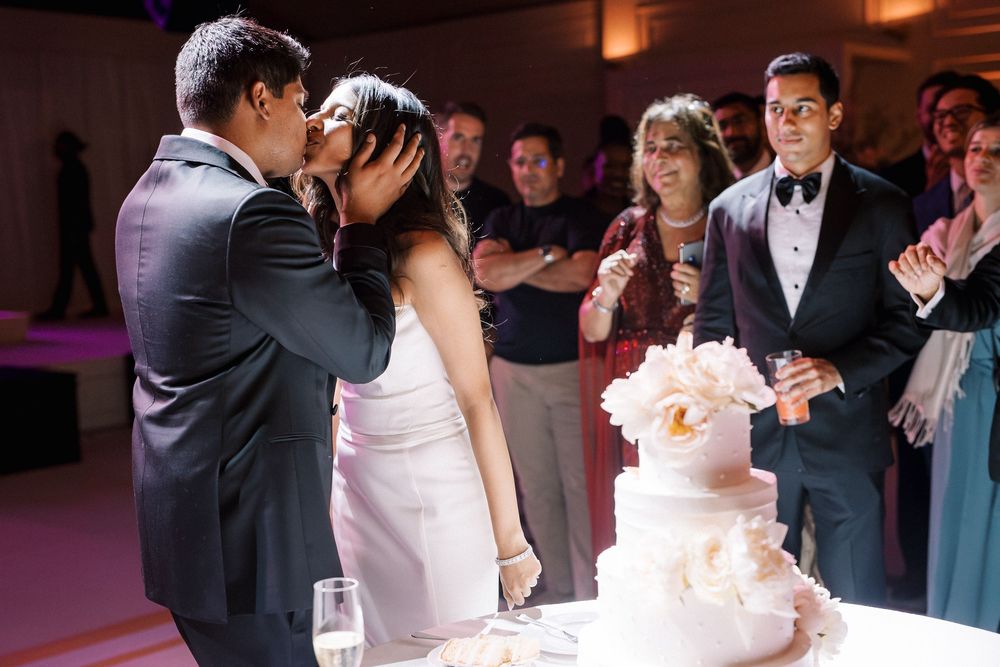 Cake cutting moment during luxury Indian destination wedding in Portugal