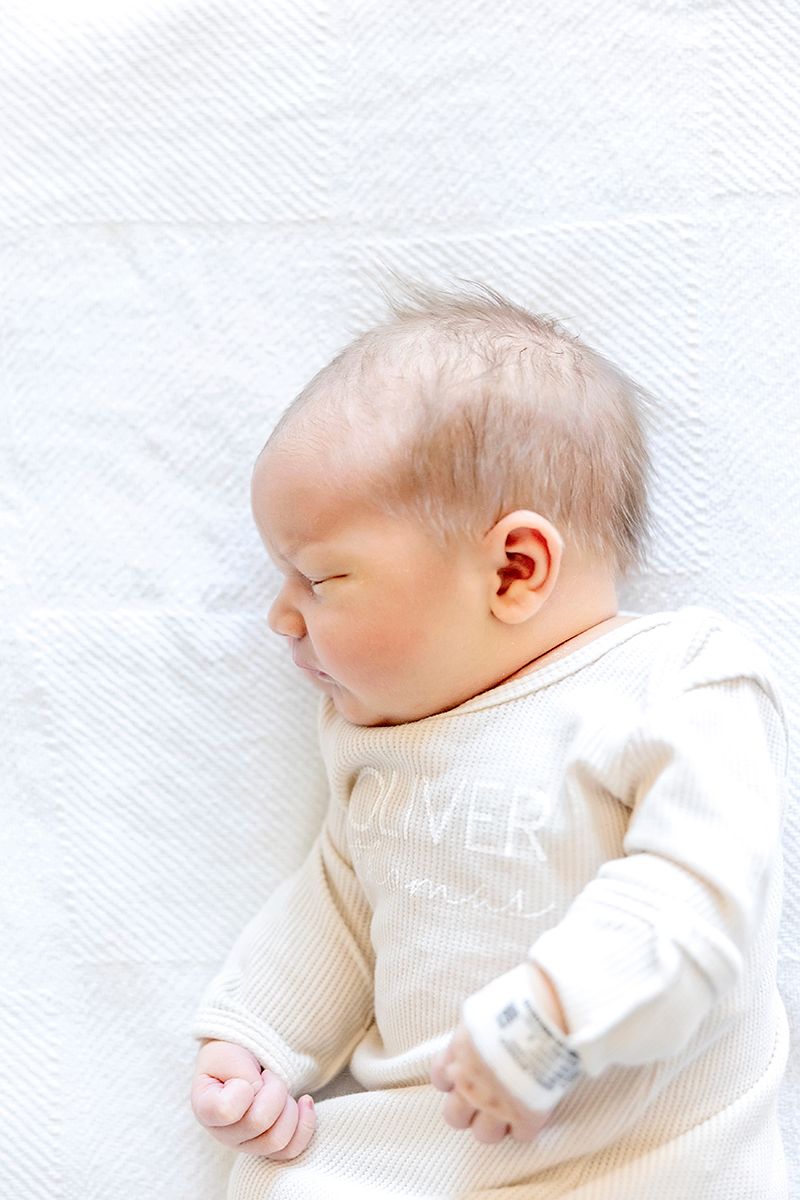 Series of peaceful images showing a sleeping baby in white clothing on white bedding.