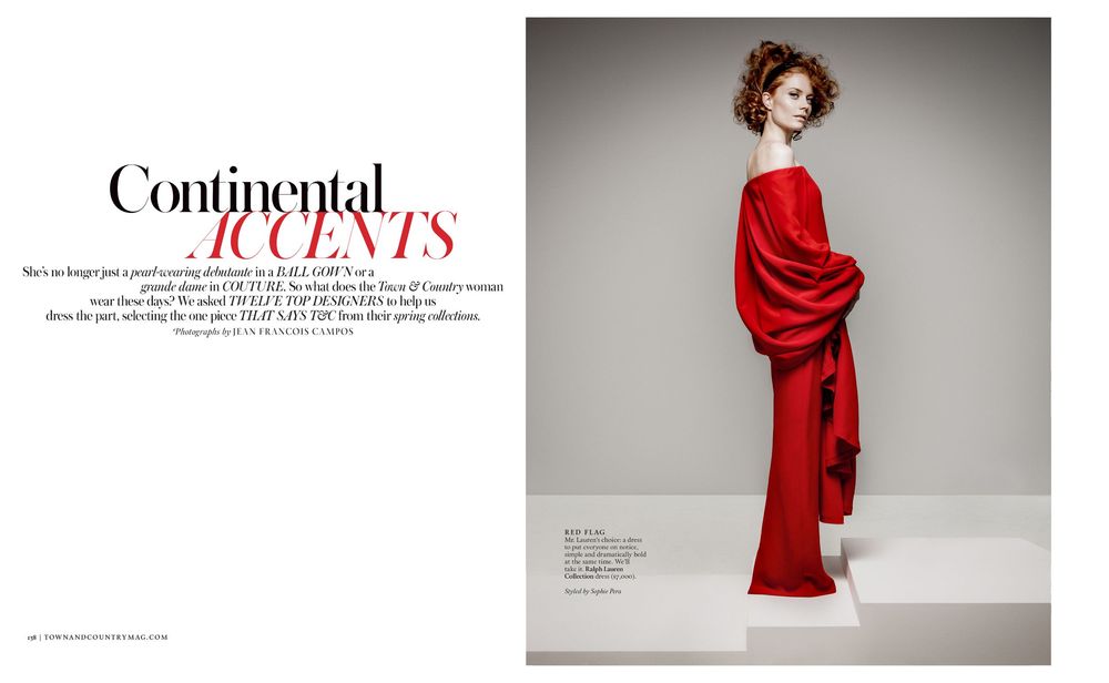 Fashion editorial spread featuring dramatic red flowing gown against minimalist grey studio backdrop.