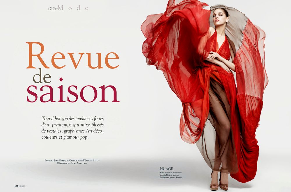 Artistic fashion layout featuring flowing red fabric against white background with French text for a seasonal magazine spread.