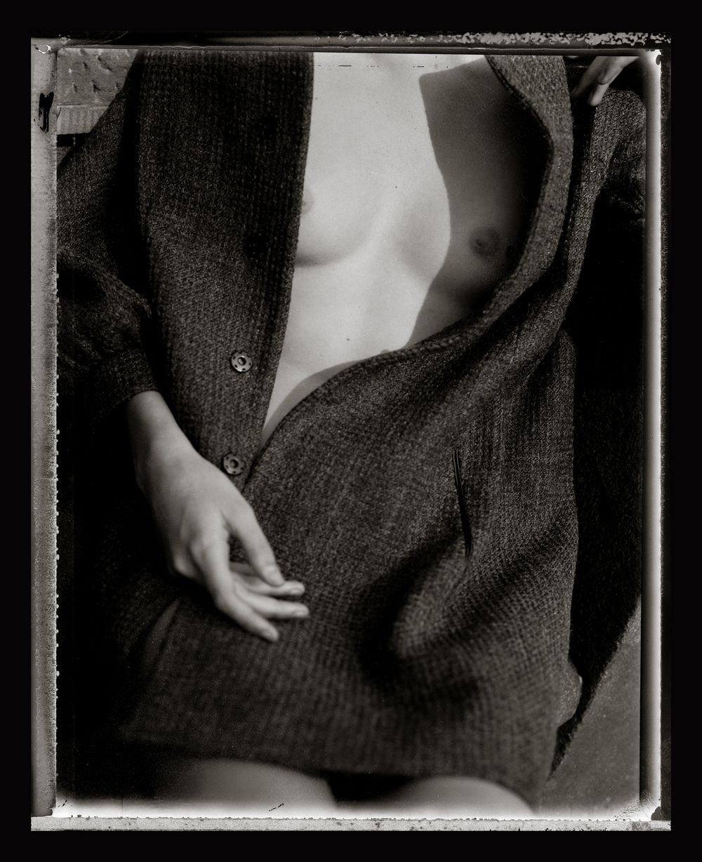 A series of black and white artistic photographs showing close-up details of a dark woolen sweater or coat.