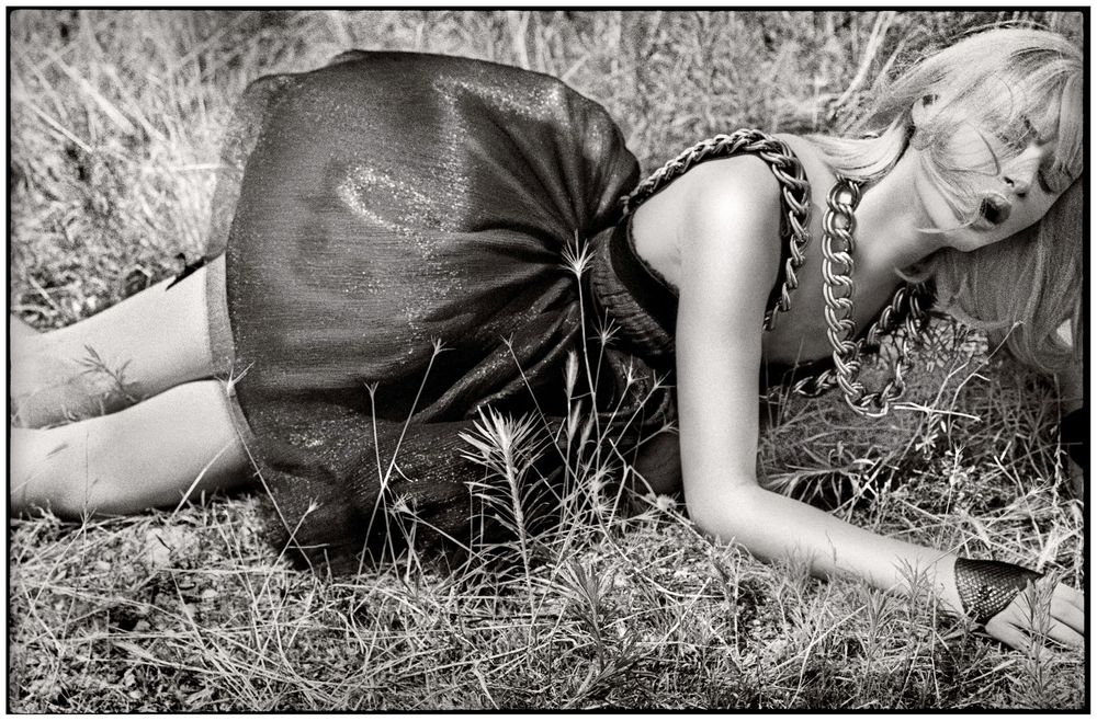 Black and white photos of a figure lying in grass wearing a light colored dress in an artistic composition.