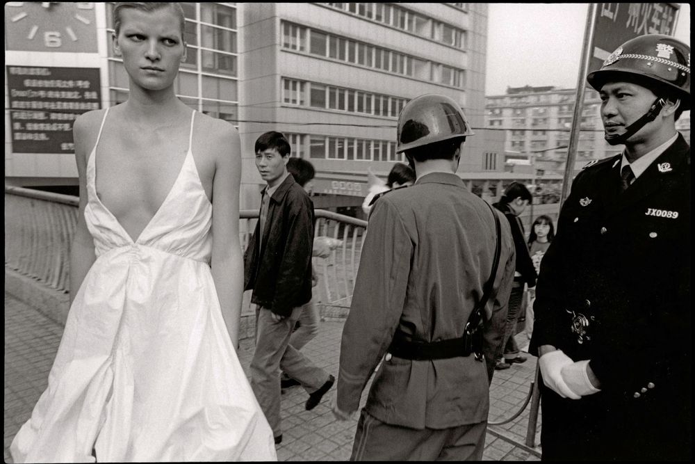 A series of black and white vintage photographs showing urban scenes and people on a city street.