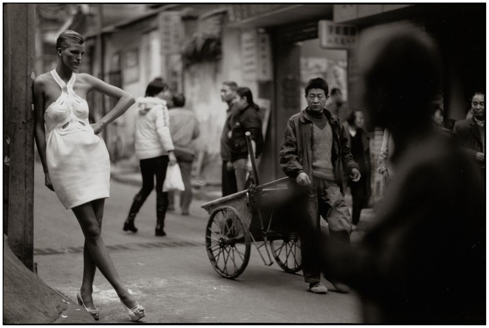 A series of black and white street photographs showing people walking and interacting in urban settings.