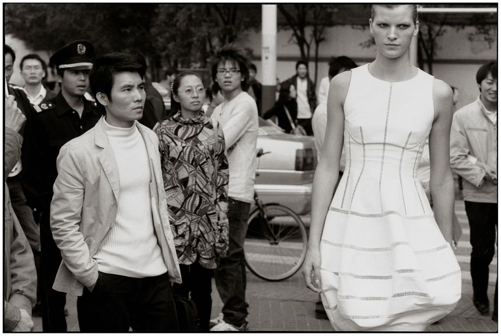 A series of vintage black and white fashion photographs showing models in white dresses and casual wear from the 1950s era.